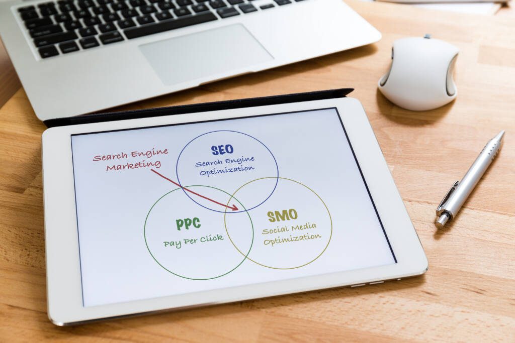 Digital marketing strategist comparing SEO and paid media performance for financial services campaign