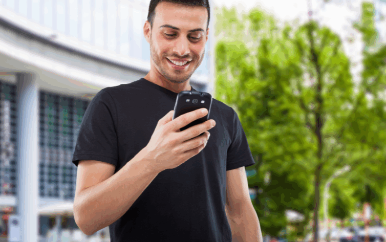 Hispanic man engaging with local community bank using mobile device